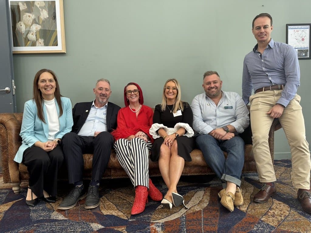 Tracy Sheen with the Greater Springfield Chamber of Commerce committee on a couch at Springlake Hotel after the workshop