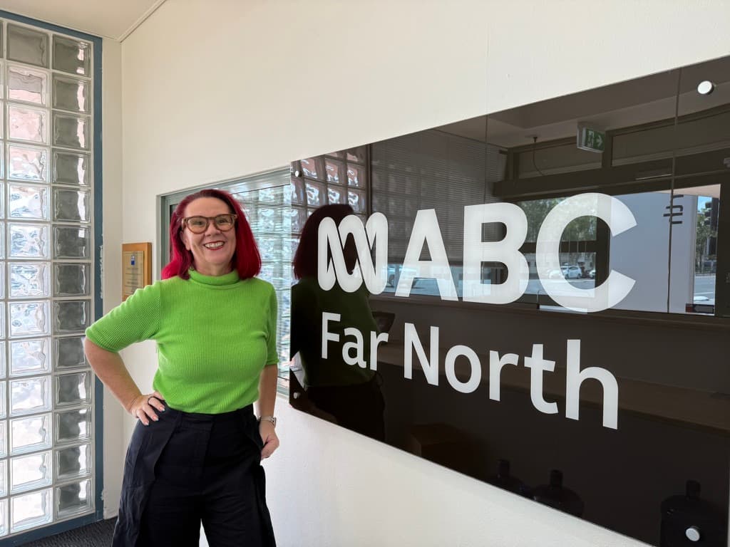 Tracy Sheen beside the ABC Far North sign at the Cairns studio