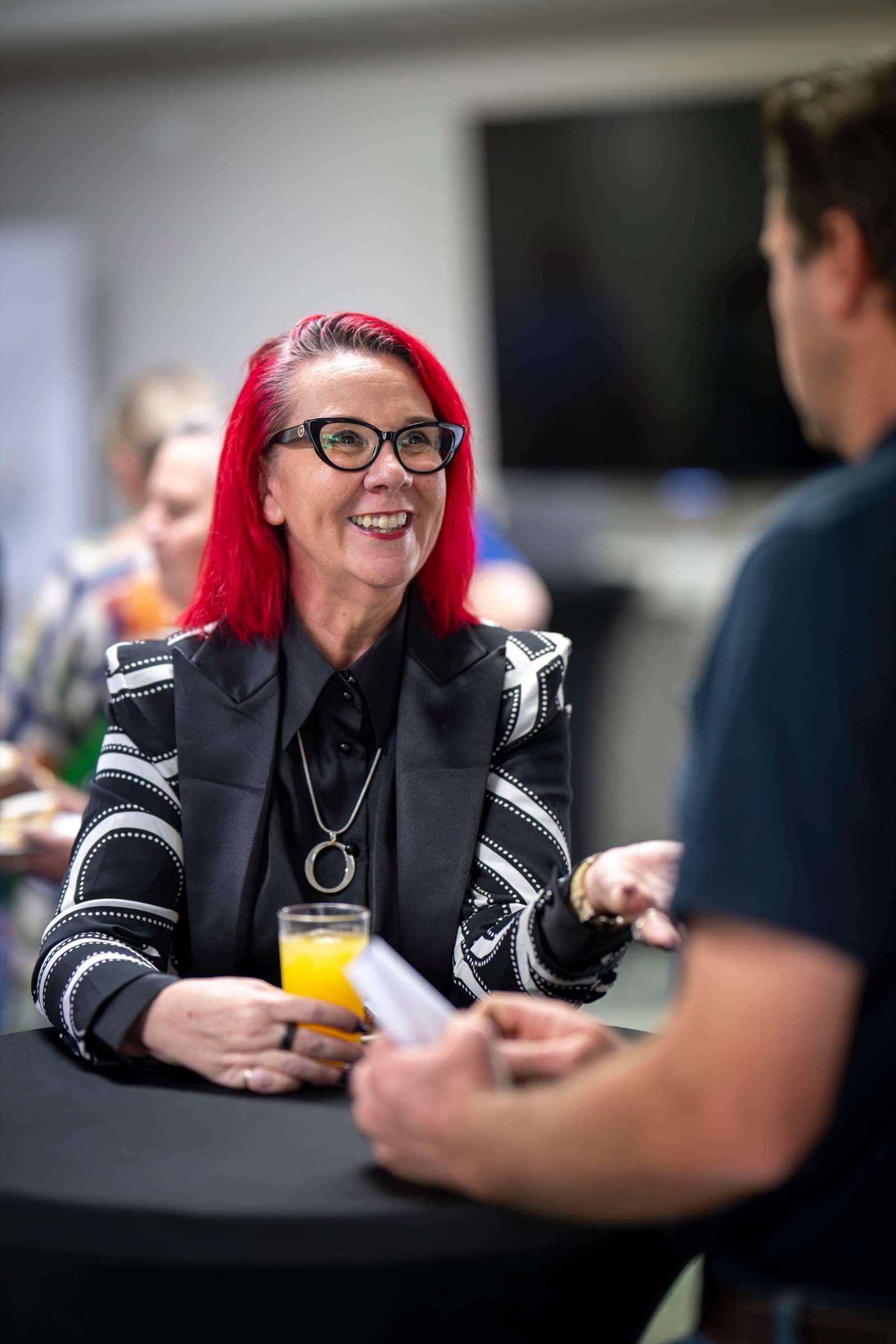 Tracy Sheen in conversation with a delegate at the Western Downs Regional Business Summit.